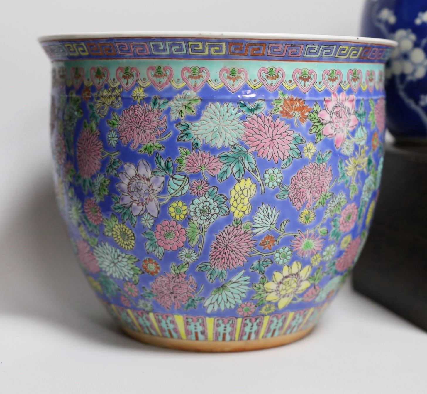 A Chinese Kangxi blue and white miniature vase, 9cm tall, a 19th century Chinese wood writing box, a famille rose jardiniere, blue and white jar and cover etc.